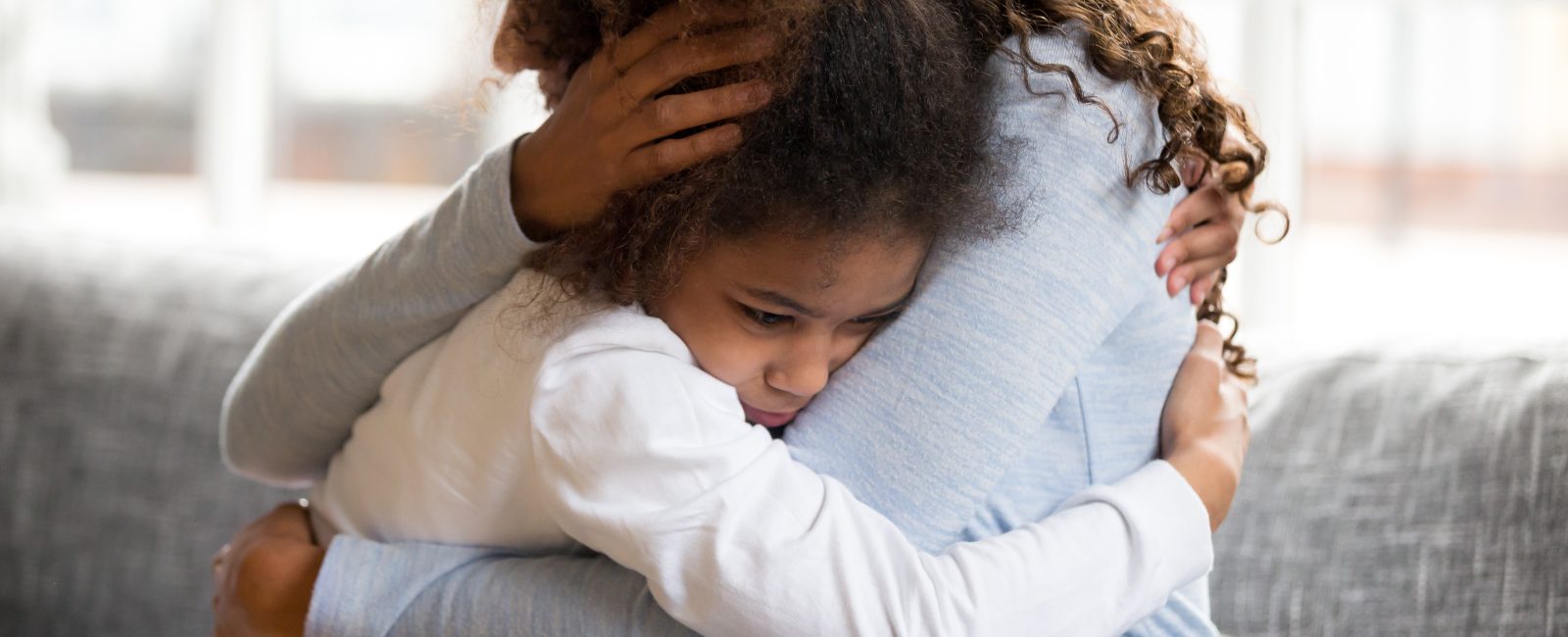 woman hugging daughter