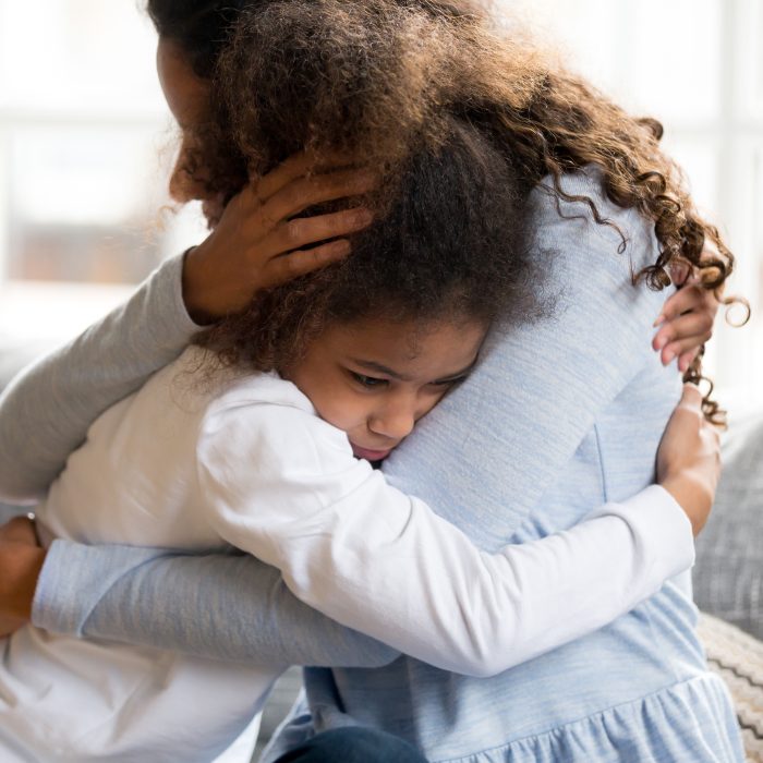 woman hugging daughter