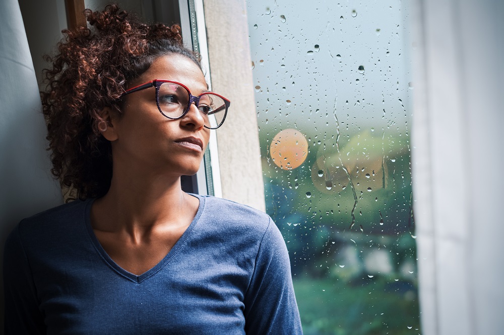 woman looking out of window